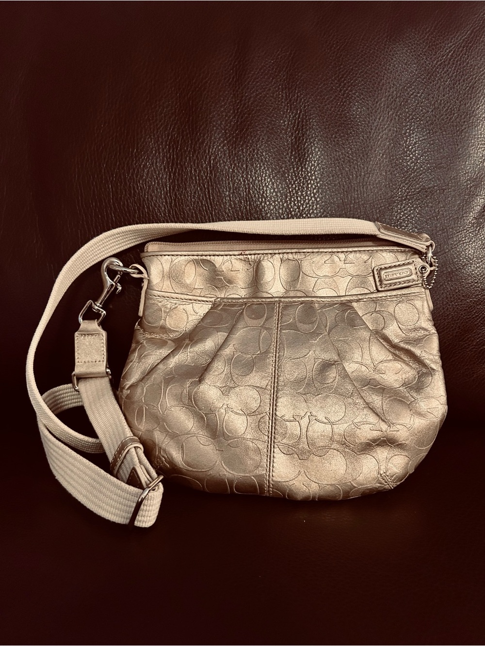 Coach Metallic gold Signature Crossbody Bag. 9x8”. Zipper top.